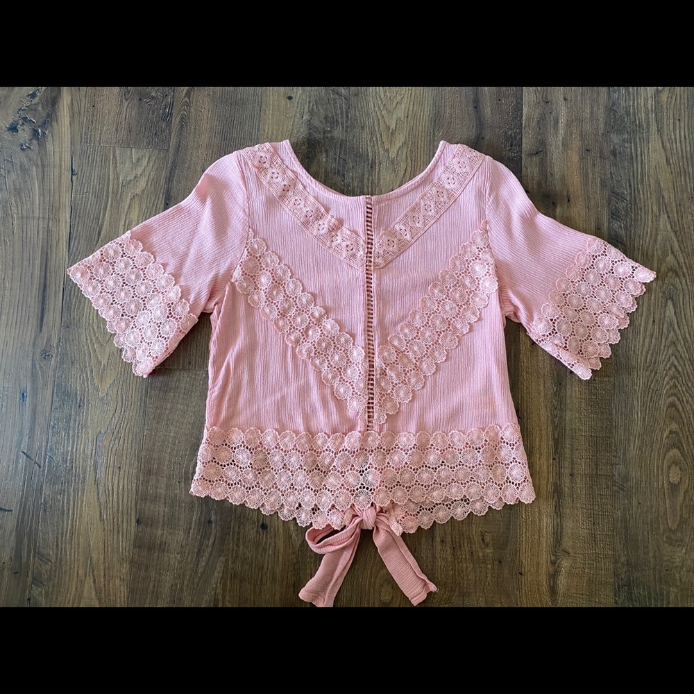 Pink blouse with lace details